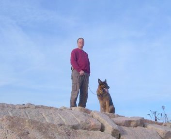 Professional dog trainer Scott Kalisz with my male German Shepherd Dog Fanto on the pier at Meigs point